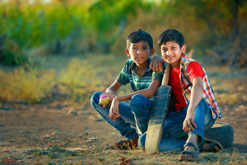 Rural Indian Child Playing Cricket