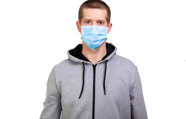 Man in sports jacket with hood and medical mask on his face, isolated