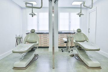 Partition between dental chairs in clinic