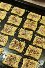 Making gluten free maize and rice flour cookies with poppy seeds, sesame and flaxseed