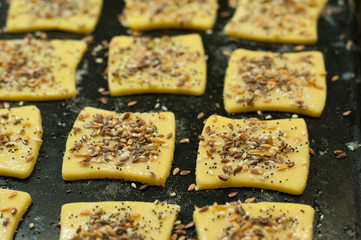 Making gluten free maize and rice flour cookies with poppy seeds, sesame and flaxseed