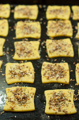 Making gluten free maize and rice flour cookies with poppy seeds, sesame and flaxseed