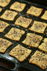 Making gluten free maize and rice flour cookies with poppy seeds, sesame and flaxseed