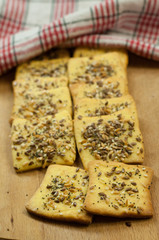 Making gluten free maize and rice flour cookies with poppy seeds, sesame and flaxseed