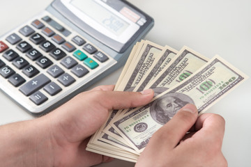 Man counting money, economy concept, allocation of money,Crisis after the covid-19 epidemic .Dollar falling or rising.