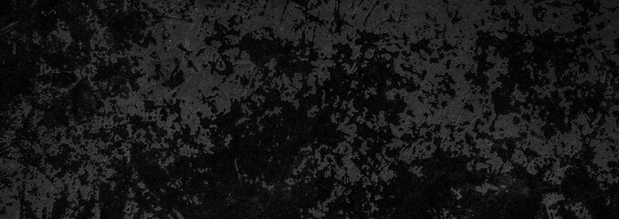 Fototapeta na wymiar Black background of a texture of cement, stone and concrete - Dark stage background - Large panoramic format