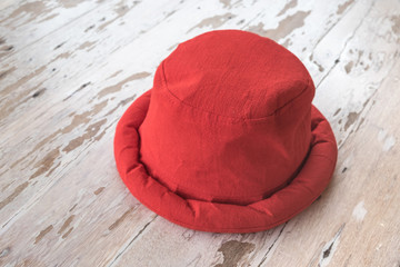 Red hat on wood background