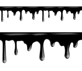 Black paint dripping isolated on white background.