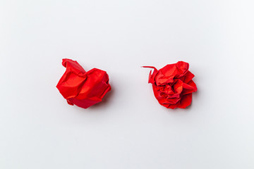 A red ball of crumpled office paper on a white background. - concept creative crisis.