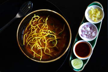 Asian food  noodles  soup  in  bowl on the wooden table vegetable and ingredient,