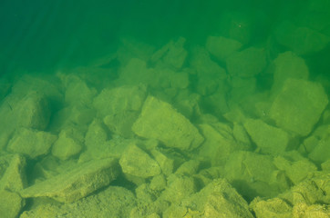 stones at the bottom in the water