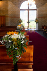 Flower decorations on church pews