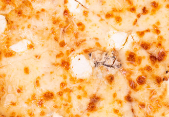 Pizza with different types of cheese, top view, macro