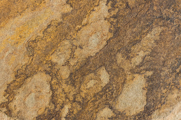 The texture of the stone is shot closeup of ordinary sandstone.