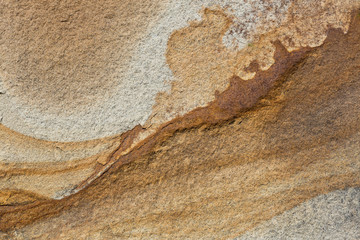 The texture of the stone is shot closeup of ordinary sandstone.