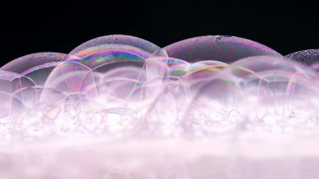 Gel Bubbles slowly flowing and closing screen liquid fluid foam Macro. Clean honey bubble flow footage background. Close-up Jelly Shampoo Soap. Shoot on Red Dragon camera (slow motion high quality).