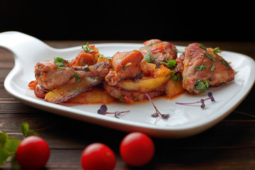 Chicken with potatoes, tomatoes, sweet onions and cilantro, chihirtma chicken