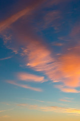 beautiful blue sky with golden clouds blurred by the wind as a natural background