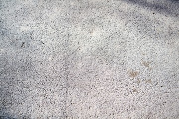 Asphalt texture in sunny summer