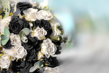 Bouquet of black and white roses. A tragic event.