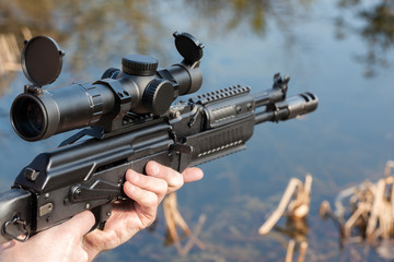 A man is holding a rifle