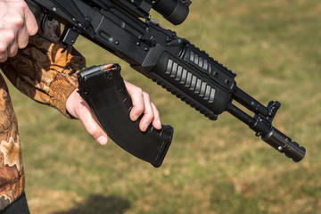 A man is holding a rifle