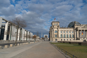 Naklejka premium View of Berlin's landmarks, the Bundestag and Berliner Fernsehturm surrounded by empty streets during the city's lockdown due to the COVID-19 spreading