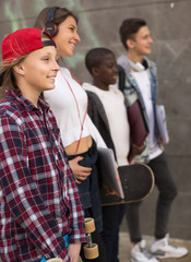 group of teenagers posing and smiling in yard