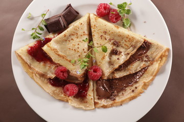 gourmet crepe with chocolate and raspberry jam