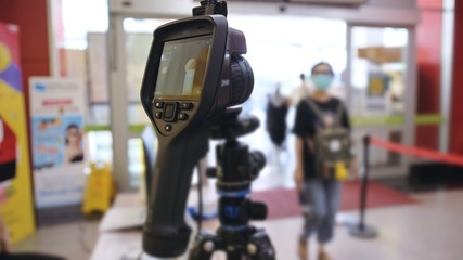 Temperature check at a supermarket, grocery store with a thermal imaging camera installed. Image...