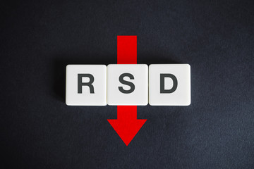 Serbian dinar alphabetic currency ISO code (RSD) and down red arrow on black background. Economy of...