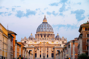 Fototapeta na wymiar Sunrise over the St. Peters Basilica in Vatican City. Morning at the most famous landmark