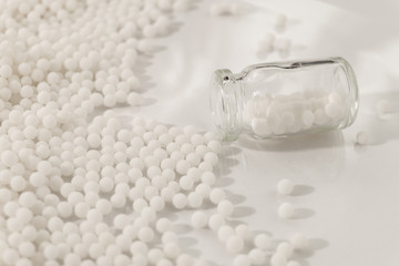 Homeopathy granules medicine isolated on a White Background