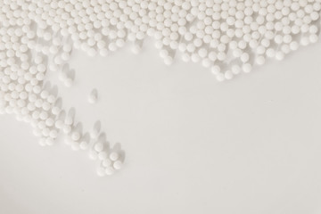 Homeopathy granules medicine isolated on a White Background