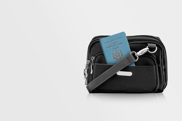 Afghanistan Passport in Black Travel Bag Pocket with Copy Space on Isolated Background