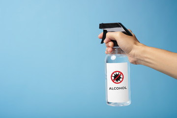 man using spray alcohol cleaning for protect anti virus bacteria.  Preventive measures against...