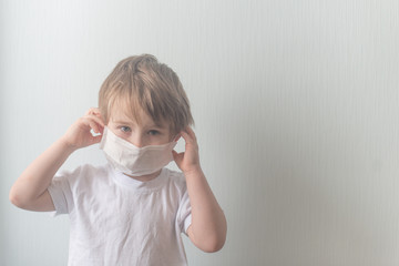 Boy wears medical mask