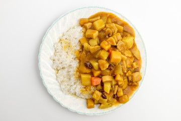 Curry and rice on white background