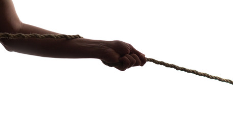 silhouette man hand pulling a rope tug of war on isolated white background, concept of leadership...
