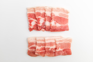 Sliced ​​pork belly on white background