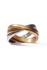 Close-up shot of a tricolour rolling ring symbolizing friendship, loyalty and love. The unique ring with satin gloss is isolated on the white background.
