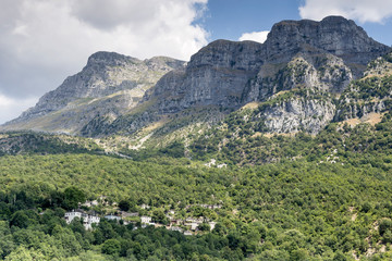 Fototapeta na wymiar View of the village in the mountains on a sunny day (village Papigo, Epirus region, Greece).