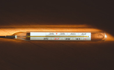 Thermometer on which the light falls on the table