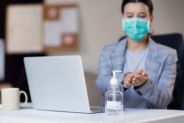 Woman hands using hand alcohol gel or sanitizer bottle dispenser, against corona virus Covid-19. Antiseptic, hygiene and health concept. Prevention of the pandemic virus outbreak