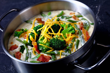 close-up of cream soup with broccoli, green bean