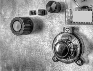 Close up view of front panel of a high frequency power amplifier with vacuum tubes in black and...