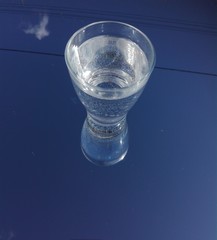 glass of water on blue background