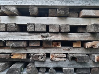 Abstract background of firewood piled in a village