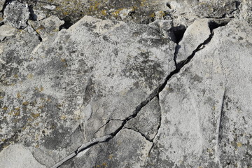 The surface and texture of the destroyed concrete slab.