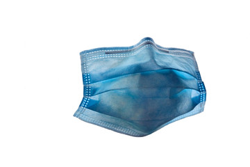 Blue surgical face mask against white background.